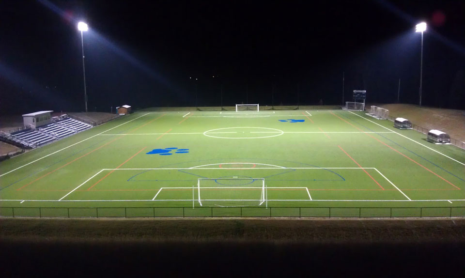 soccer field under night lights